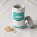 Magnesium Complex capsules beside the open pot