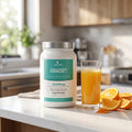 Collagen Complex + tub on a kitchen counter with orange slices