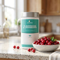 D-Mannose & Cranberry pot on a kitchen counter with fresh cranberries