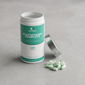 Multivitamin Complete capsules beside the open pot