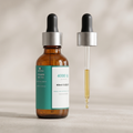 Vitamin D3 + K2 dropper bottle with glass pipette raised beside it